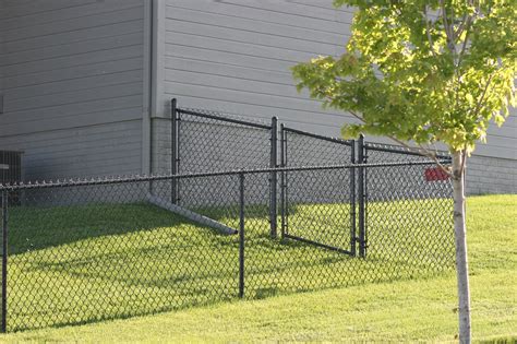 black chain link fence post