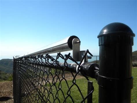 coyote rollers for chain link fence